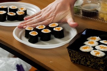 Rolls with rice and red fish. Home order