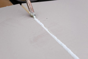 Roofing insulation, installation of insulation sheets on foam