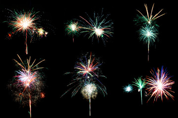 Set of six unique burning festive fireworks with luminous different colors isolated on black background.