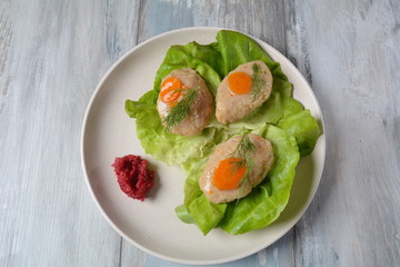 Traditional Jewish Passover food- gefilte fish with carrots, lettuce and horseradish. Rosh Hashana table setting