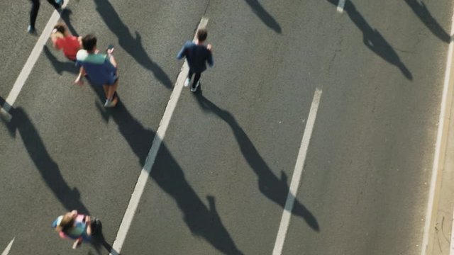 Aerial shot of marathon runners jogging