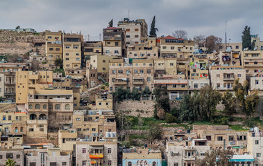 Fototapeta na wymiar Buildings on a steep hill in the center of Amman, Jordan