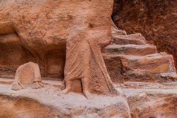 Rock carvings in the Siq (narrow gorge, main entrance to the ancient city Petra), Jordan