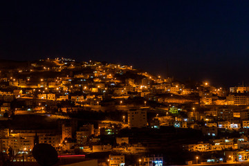 Fototapeta premium Night in Wadi Musa, town located near the archaeological site Petra, Jordan