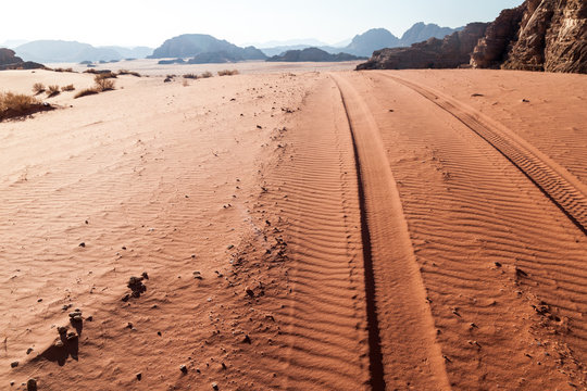 Tire tracks on a sand dune in Wadi Rum desert, Jordan