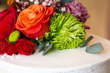 Close up of flower arrangement on top of cake