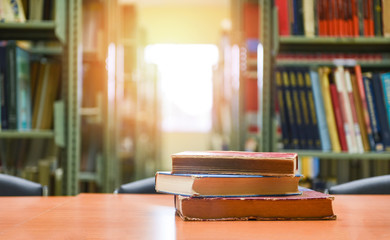 Old books on a wooden table - Book stack in the library room for business and education background , back to school concept