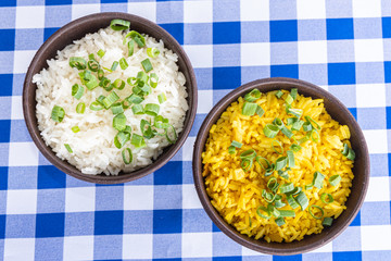 White and yellow rice bowl on blue and white table