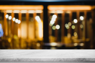 Empty white marble stone table top and blur glass window interior restaurant and night club banner mock up abstract background - can used for display or montage your products.