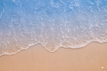Soft wave on sandy beach. Background.