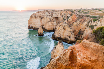 Sunset at the rocky cliffs at Ponta da Piedade near Lagos, Portugal