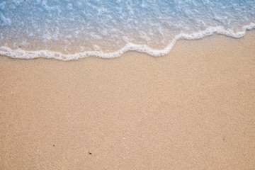 Soft wave on sandy beach. Background.