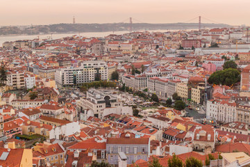 Fototapeta na wymiar Panorama of evening Lisbon from Miradouro da Graca viewpoint, Portugal