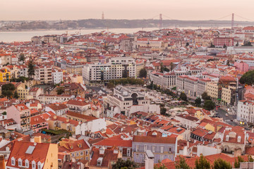 Fototapeta na wymiar Panorama of evening Lisbon from Miradouro da Graca viewpoint, Portugal