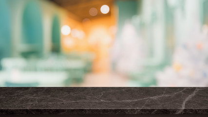 Empty black marble stone table top and blur glass window interior restaurant banner mock up...