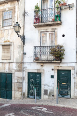 Fototapeta na wymiar Building with balconies in Alfama neighborhood of Lisbon, Portugal