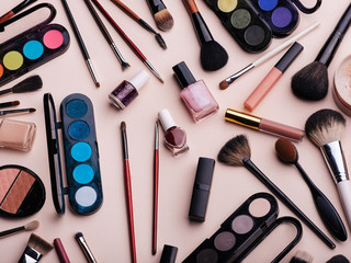 Women's cosmetics and makeup set on pink background. Top view