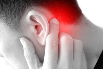 The young man touched his ear and he had a sore ear.