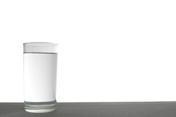 Drinking water and a glass of mineral water placed on the table on the White Blackground