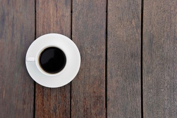 cup of coffee on wooden background
