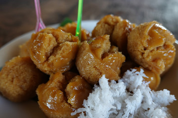 Thai dessert close up in ceramic cup on wooden table