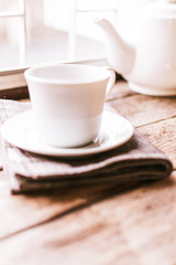 cup of tea and scone on table