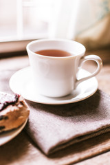 cup of coffee and cookies on table