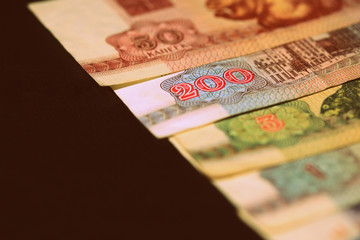 Outdated Belarusian rubles banknotes issued in the 90s. Money background retro style toned