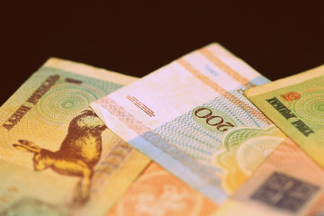 Outdated Belarusian rubles banknotes issued in the 90s. Money background retro style toned