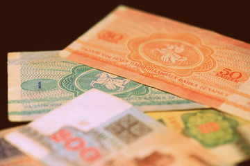 Fototapeta premium Outdated Belarusian rubles banknotes issued in the 90s. Money background retro style toned