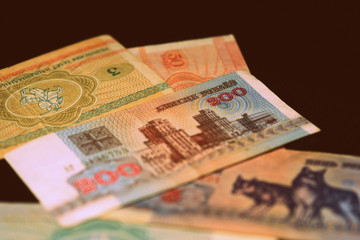 Outdated Belarusian rubles banknotes issued in the 90s. Money background retro style toned