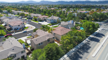 Naklejka premium Aerial View of Populated Neigborhood Of Houses With Tilt-Shift Blur