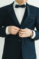 The details of the wedding day. Preparation of the groom.