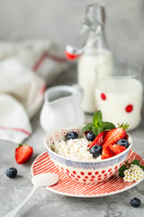 Cottage cheese with fresh strawberries and milk for breakfast. The recipe for the holiday Valentine's Day. close-up. Copy space