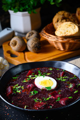Delicious beetroot borscht with egg