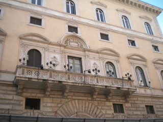 Fototapeta na wymiar Balcony at the building of Palazzo Cipolla Fondazione Roma Museo