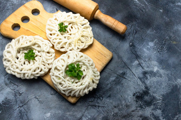 kerupuk is traditional crackers from Java Indonesia. kerupuk or crackers with celery leaf on board , copy space