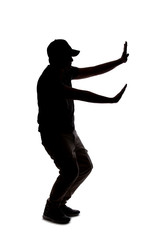 Silhouette of a man wearing casual clothes isolated on a white background. He is blocking defensive...