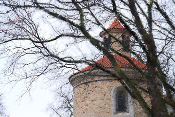 oil painting style illustration of ancient house and bare trees at winter