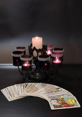 tarot cards the sun on the dark background with candlelight  