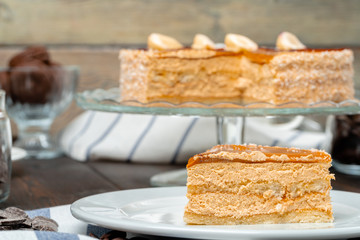Plate with delicious caramel cake close up