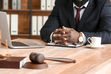African-American lawyer at table in office