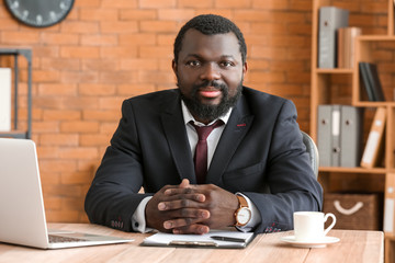 African-American lawyer at table in office