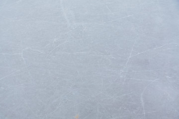 Ice hockey rink scratches surface abstract background.