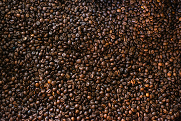 Roasted coffee beans background.Mixture of different kinds of coffee beans. Coffee concept.can be used as a background.