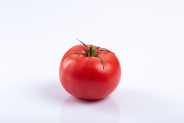 Fresh tomato on white background close up