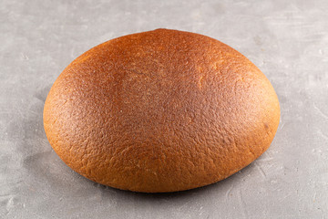 Freshly Baked Homemade Bread, close-up on a stone table