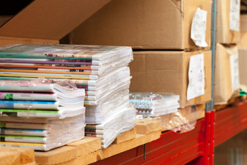 Fototapeta na wymiar Cardboard sheets pack on a shelf of warehouse