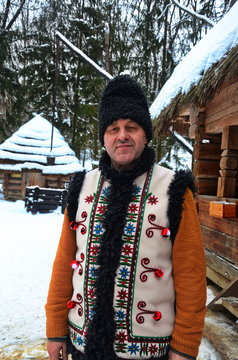 A man in a folk suit in winter.