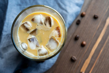 Glass of black coffee with ice closeup